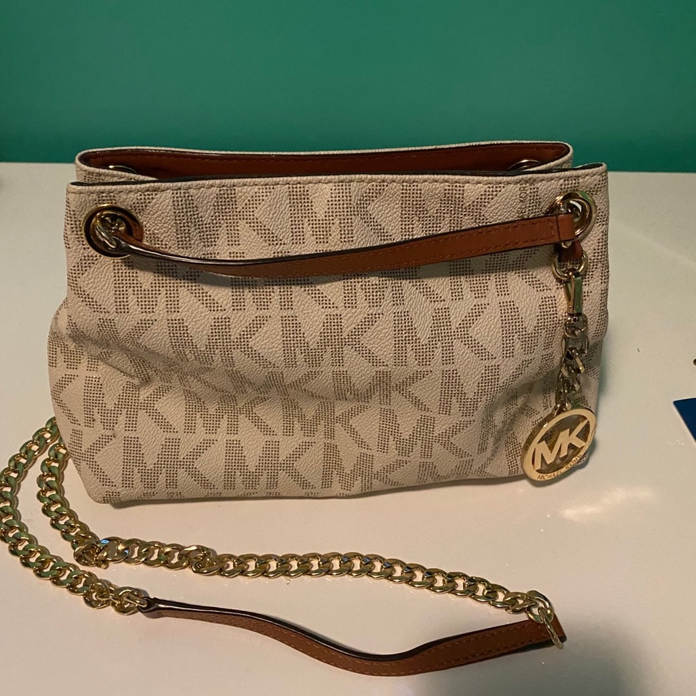 Michael Kors handbag with the white logo print.